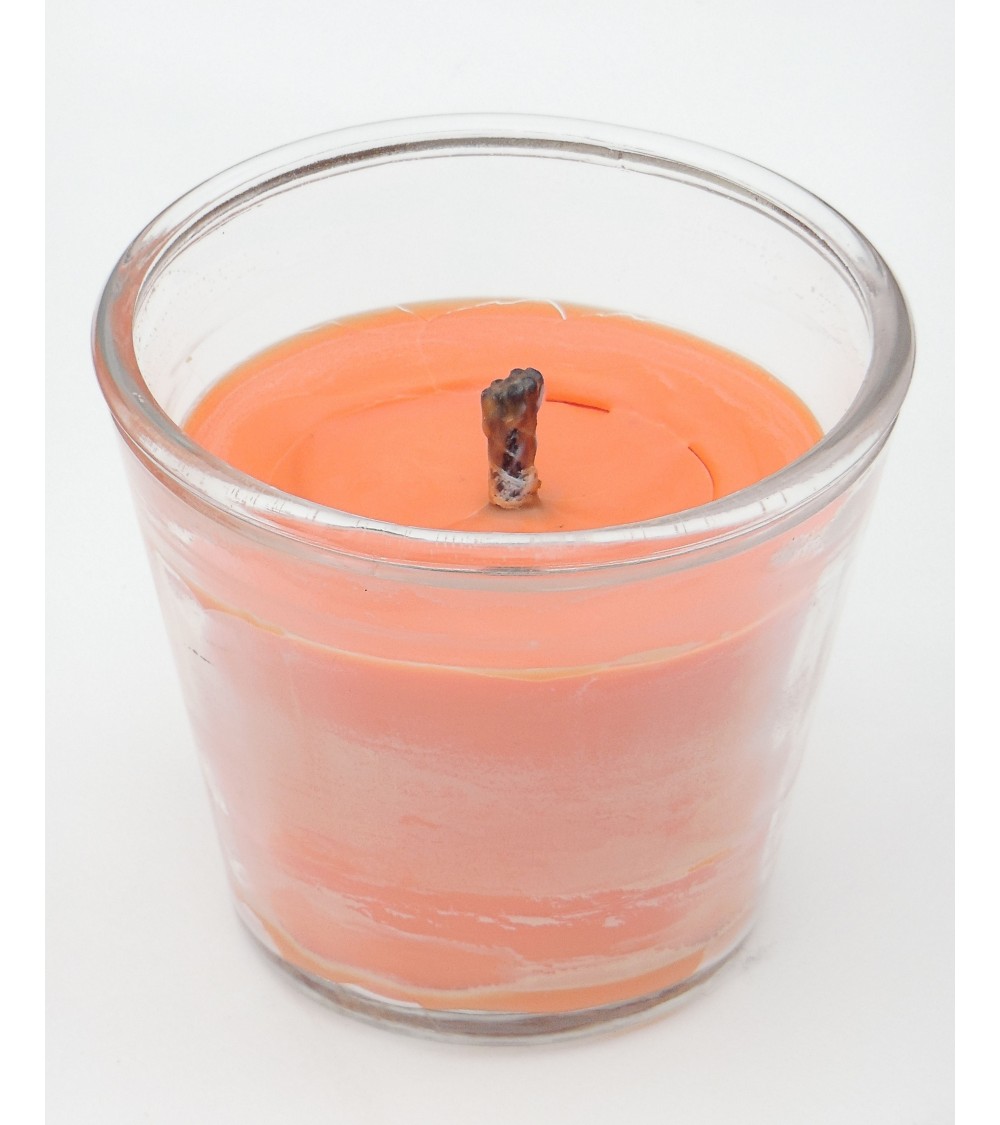 Bougie extérieure orange en pot en verre